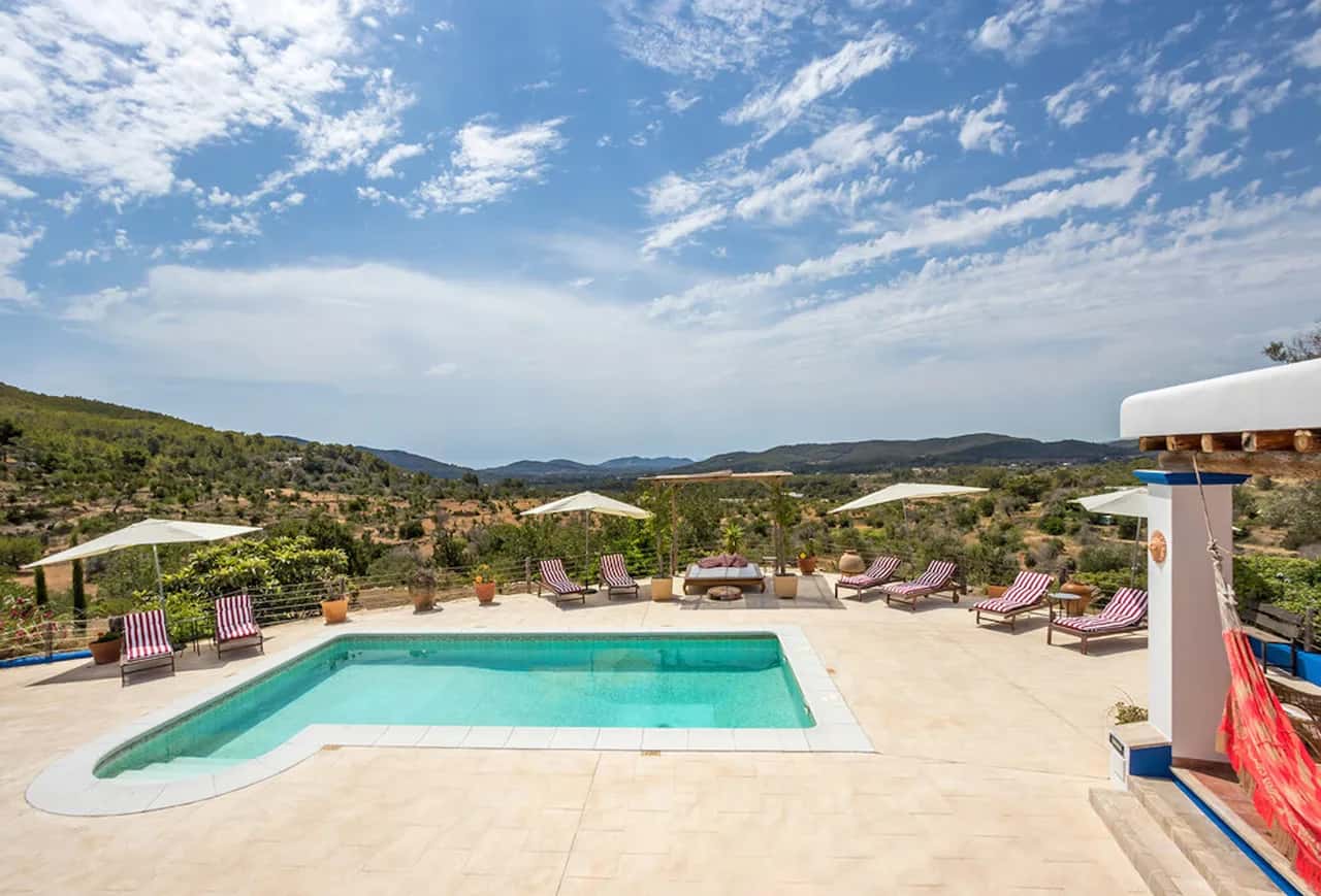 SITUATED ON A HILLSIDE JUST OUTSIDE THE VILLAGE OF SAN JUAN WITH SUNSET VIEWS OF BENIRRAS BAY
