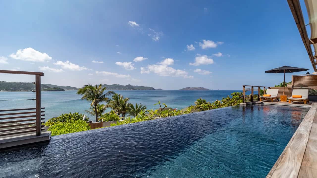 Pool-View Bedrooms Overlooking Shimmering Ocean