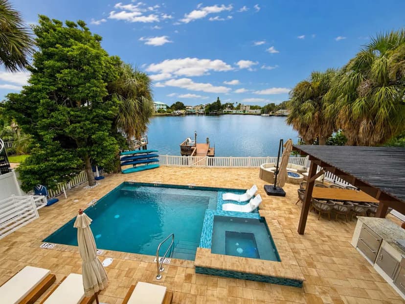 Indian Rocks Beach New Waterfront • Heated Pool & Spa • Golf Cart• E-Bikes• Kayaks • Game Room • Fire Pit • Walking Distance to the Beach