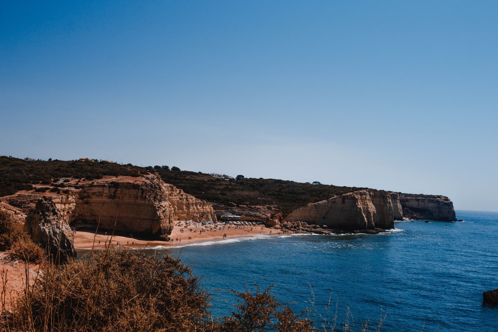 Stunning view of Carvoeiro's cliffs and tranquil beach along the Algarve coast in Portugal.