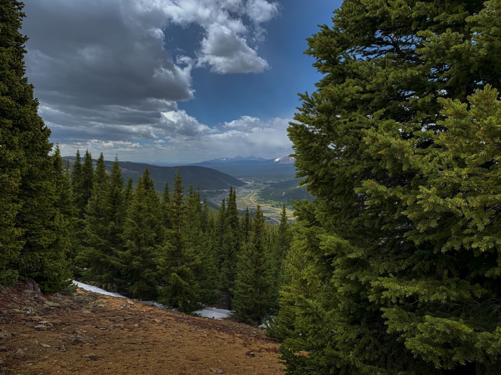 Breathtaking view of Breckenridge, Colorado with lush forests and distant mountains.