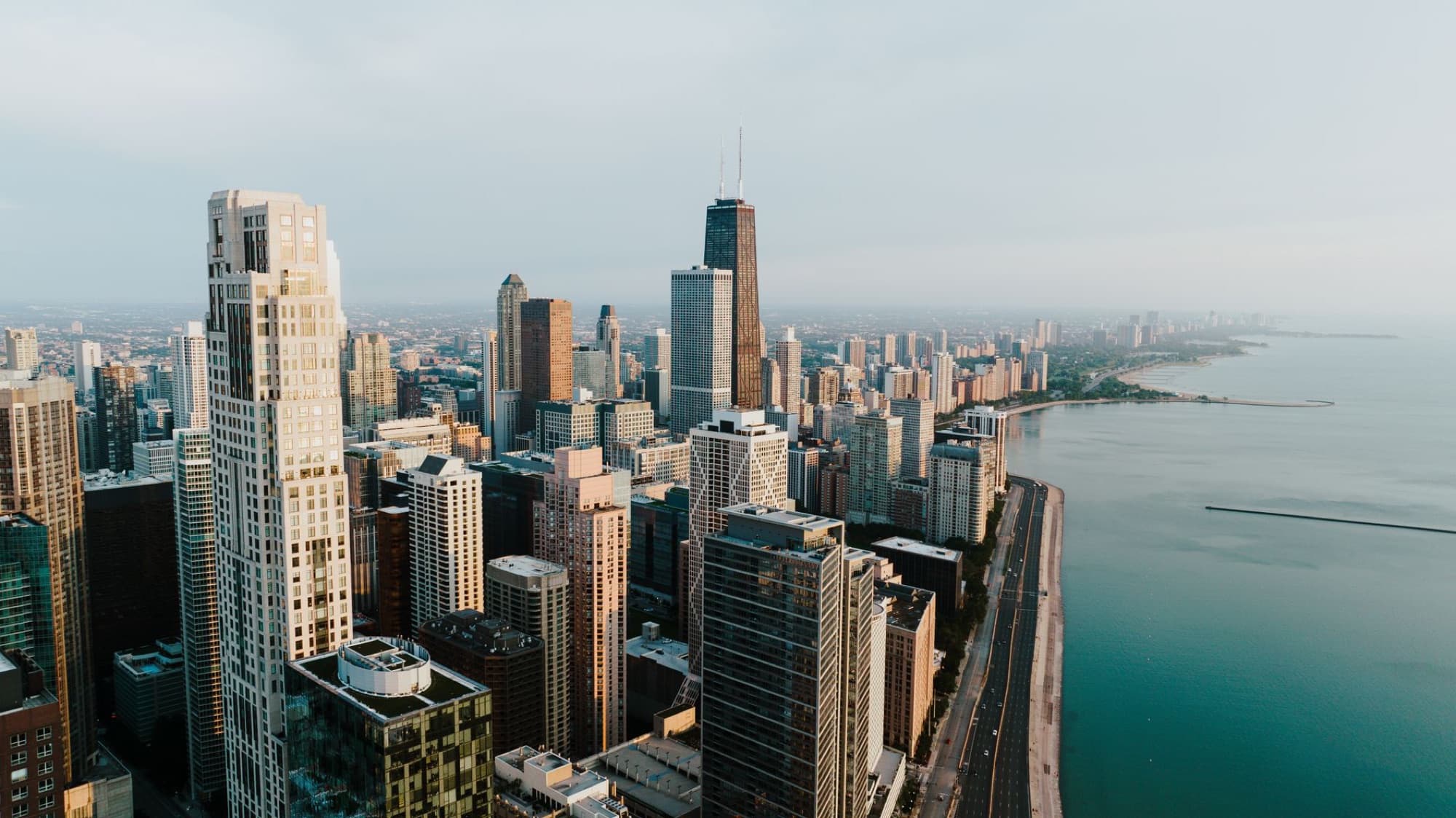 Stunning aerial view of the Chicago skyline along Lake Michigan, showcasing tall skyscrapers and beautiful skyline.