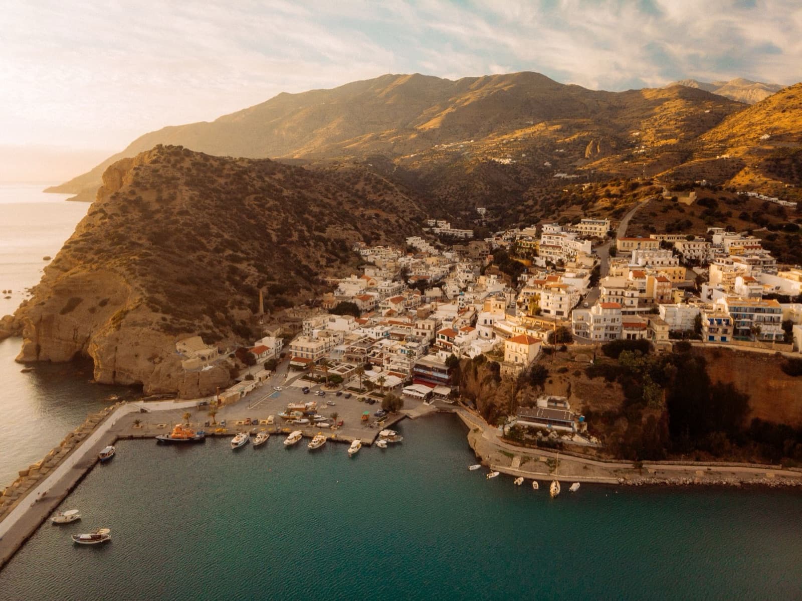 Stunning aerial view of the coastal village Panormos at sunset, Crete, Greece.
