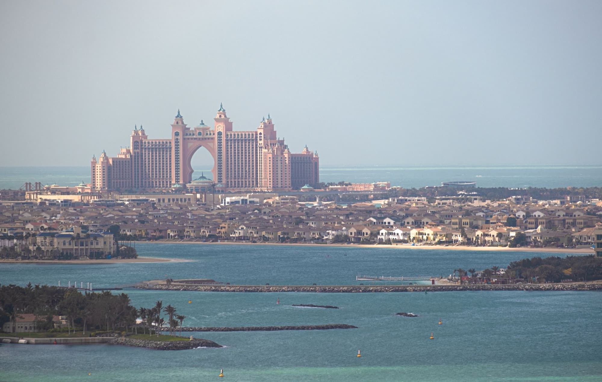 A stunning aerial view of Atlantis The Palm resort in Dubai, with the city skyline.