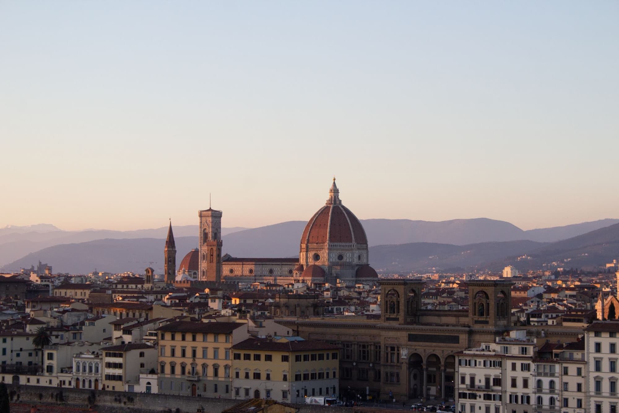 Stunning aerial view of Florence, Italy with Il Duomo at sunset. Iconic Tuscan skyline.
