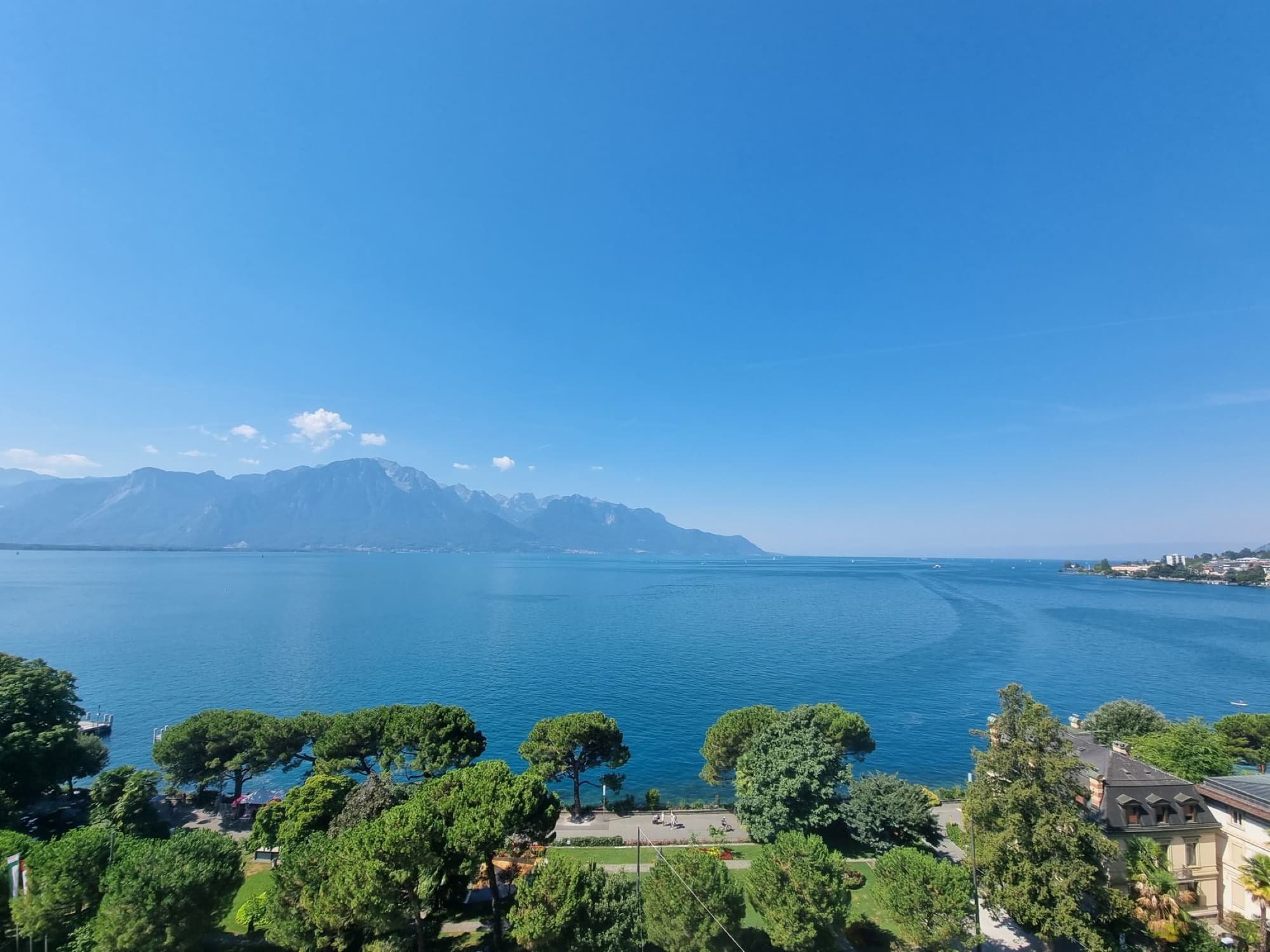 Aerial view of Montreux, Switzerland, with Lake Geneva and surrounding mountains.