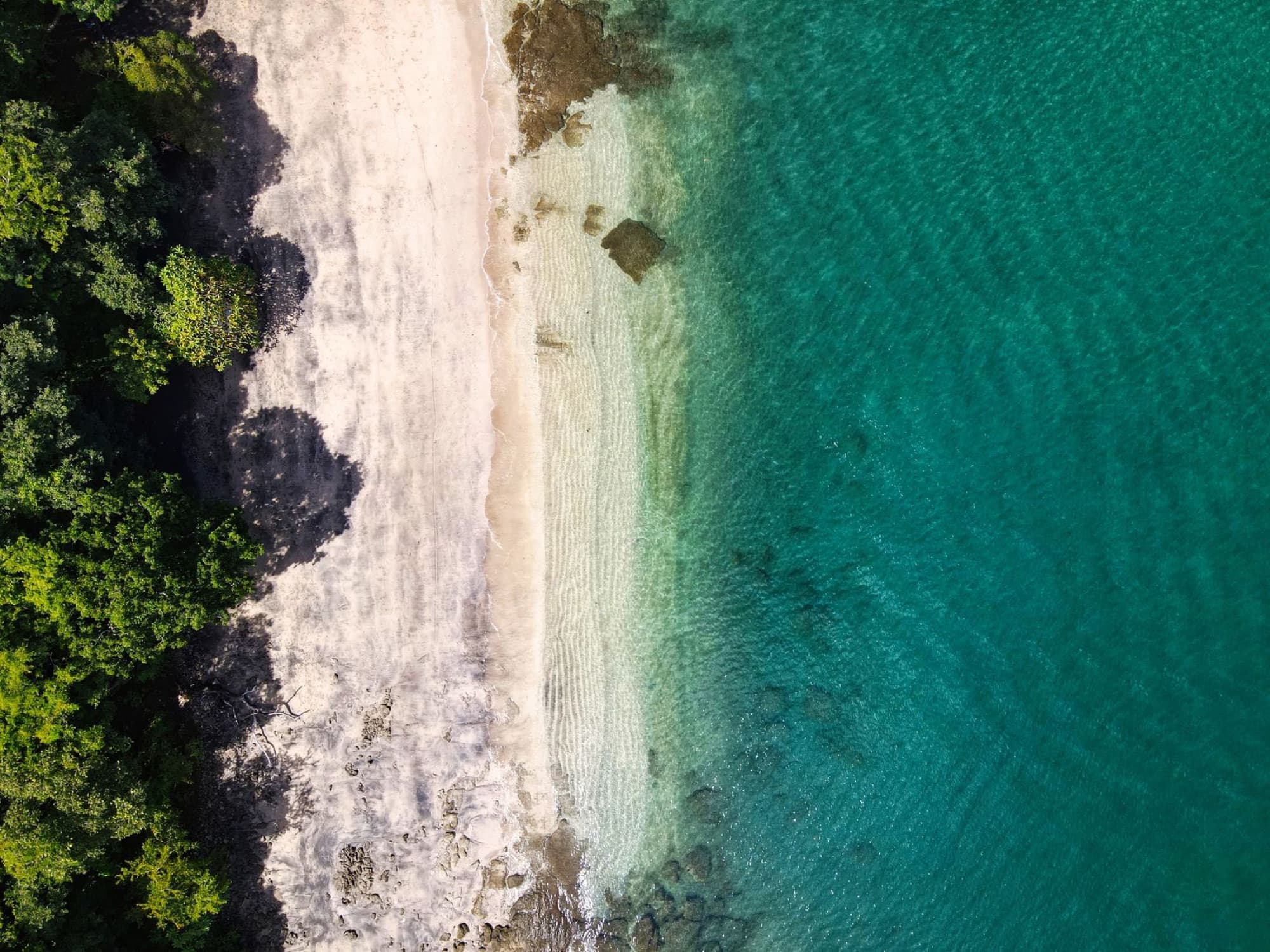 Stunning aerial view of Playa Hermosa's beach and turquoise waters in Guanacaste, Costa Rica.