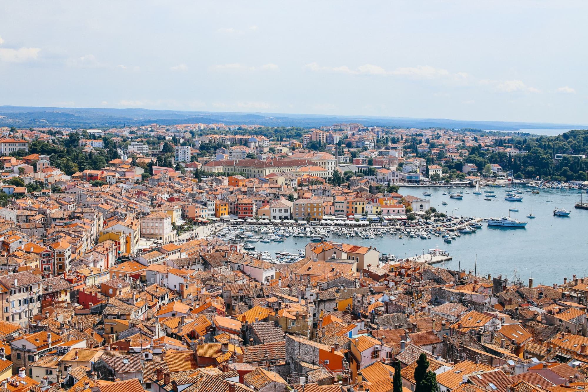 A breathtaking aerial view of Rovinj with its iconic red rooftops and serene harbor.