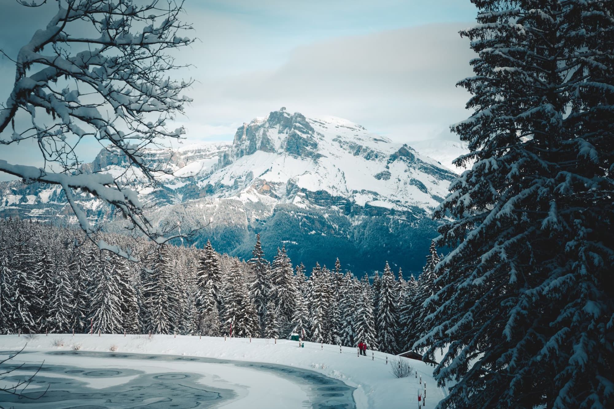 Beautiful snowy landscape of Megève with snow-covered trees and mountains in winter.