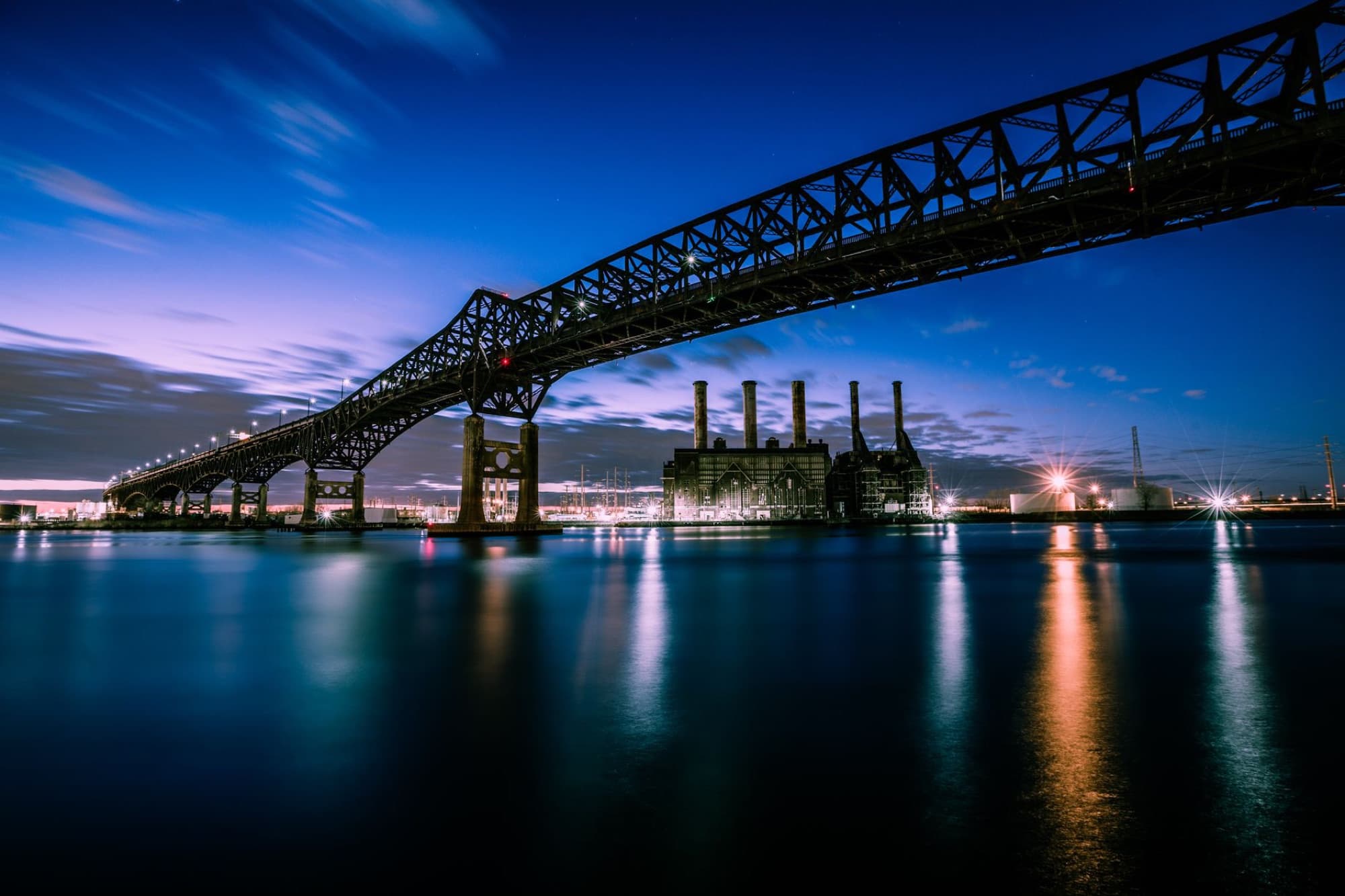 Stunning evening photograph of the Pulaski Skyway over water in New Jersey.