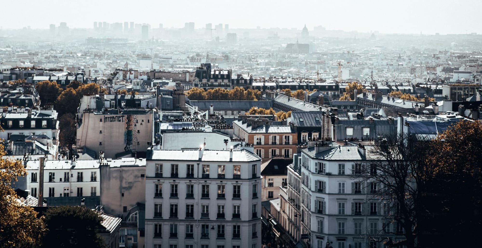 Aerial view of La Défense skyline in Paris with urban architecture and cityscape.