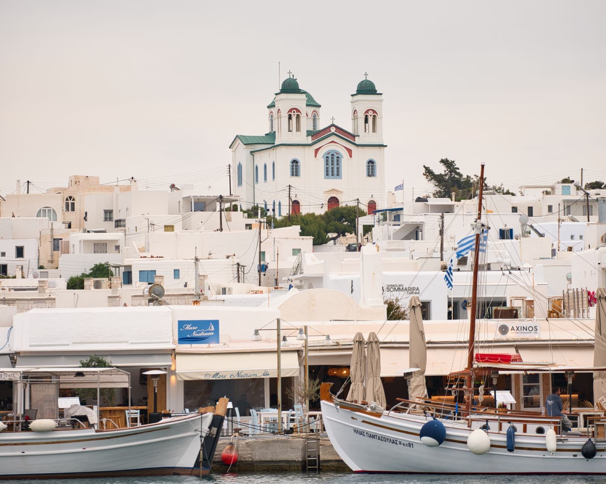 Explore the charming port and traditional Greek architecture in Naousa, Paros Island.