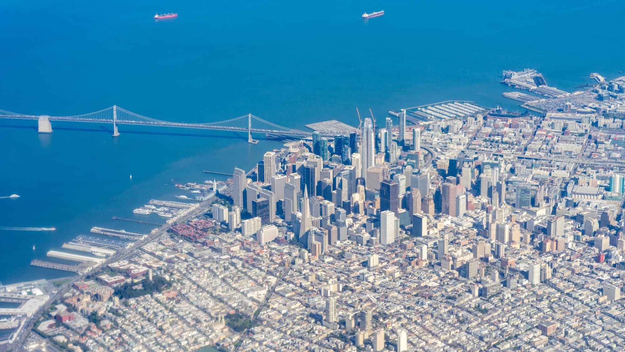 Stunning aerial view of San Francisco skyline featuring iconic skyscrapers and the bay bridge.