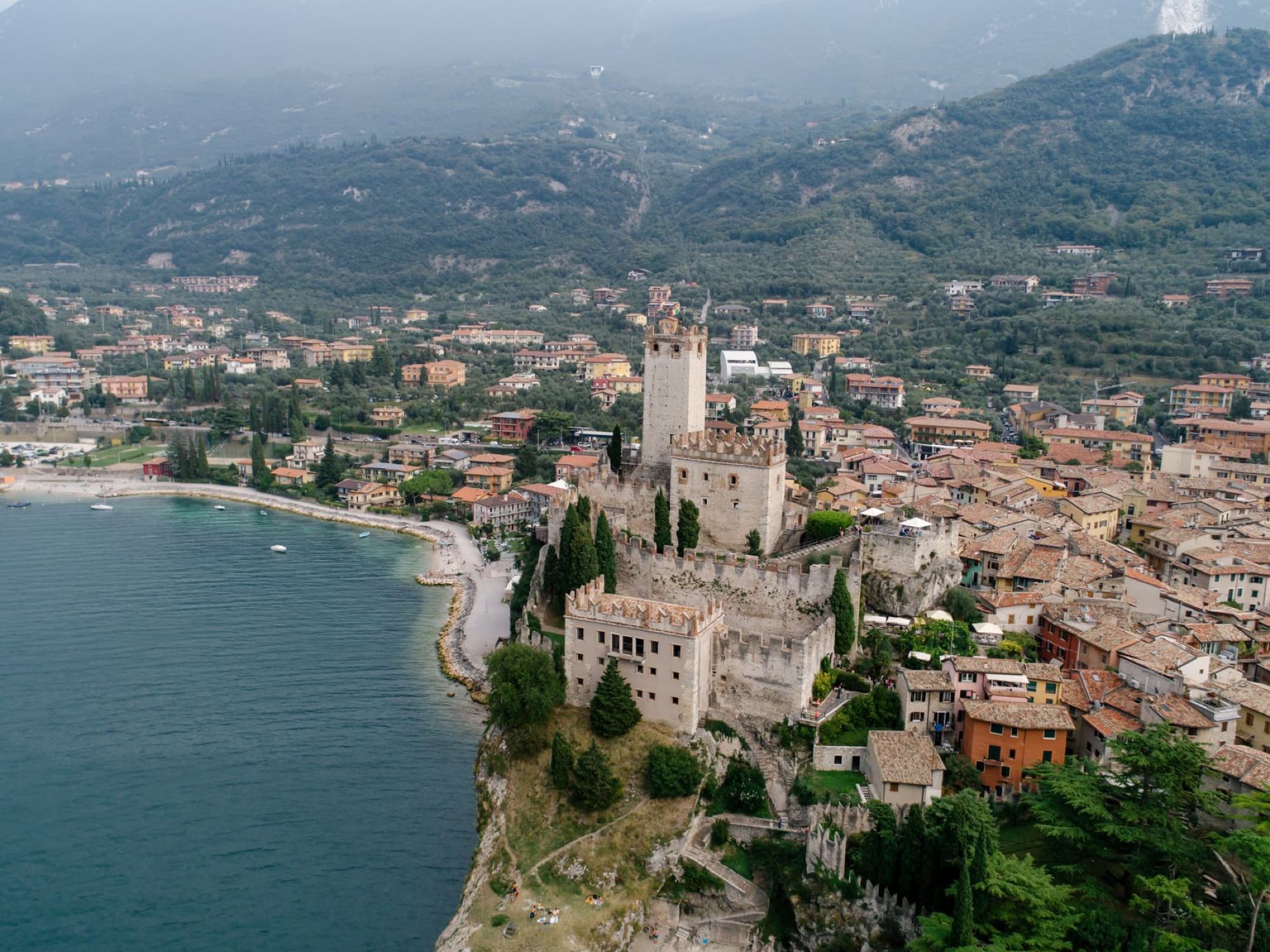 Stunning aerial view of Malcesine Castle, a medieval fortress by Lake Garda, Italy.